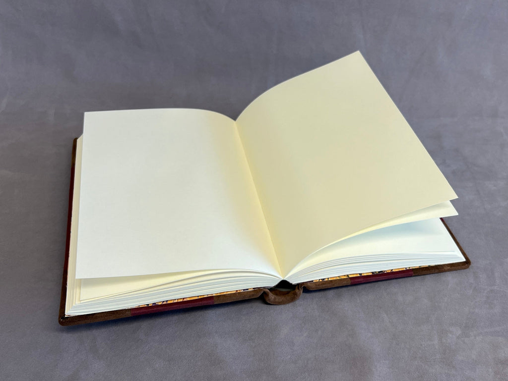 Open book with blank pages on a gray background