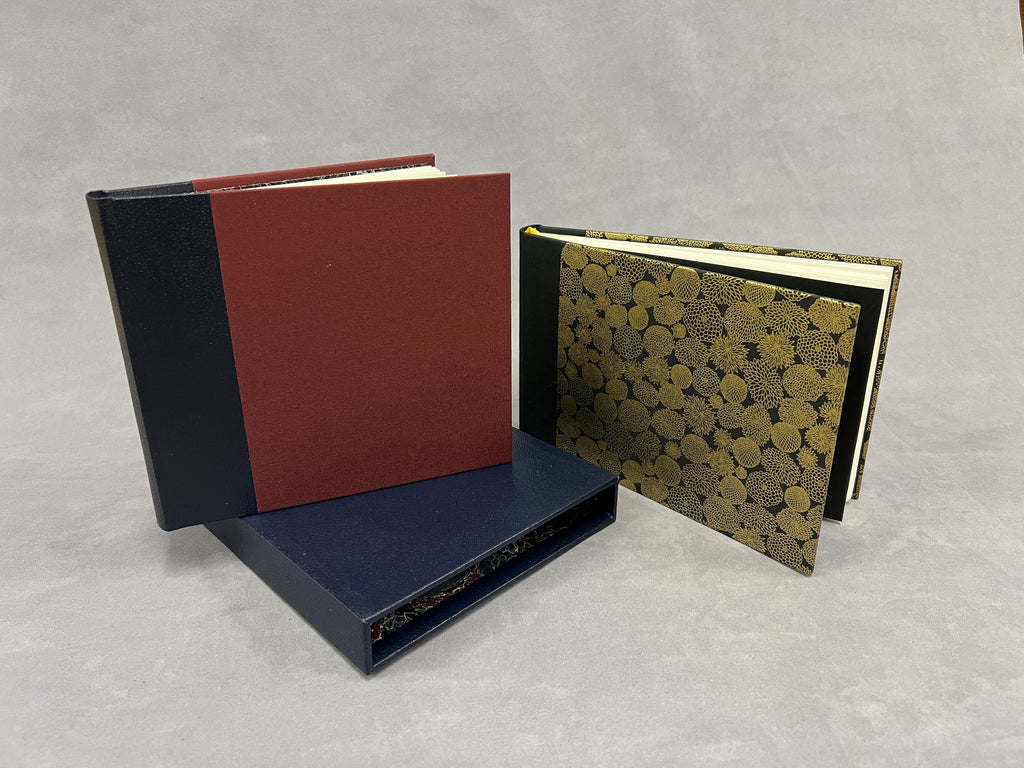 Two photo albums & slip case 